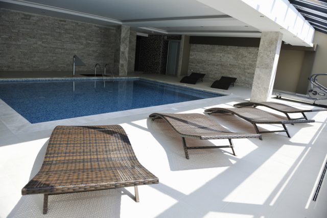 luxury swimming pool indoor at wellness and spa center