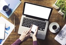 Digitalization Frees up Time for Family Corporate identity mock up on a wooden desktop with laptop, tablet and smartphone
